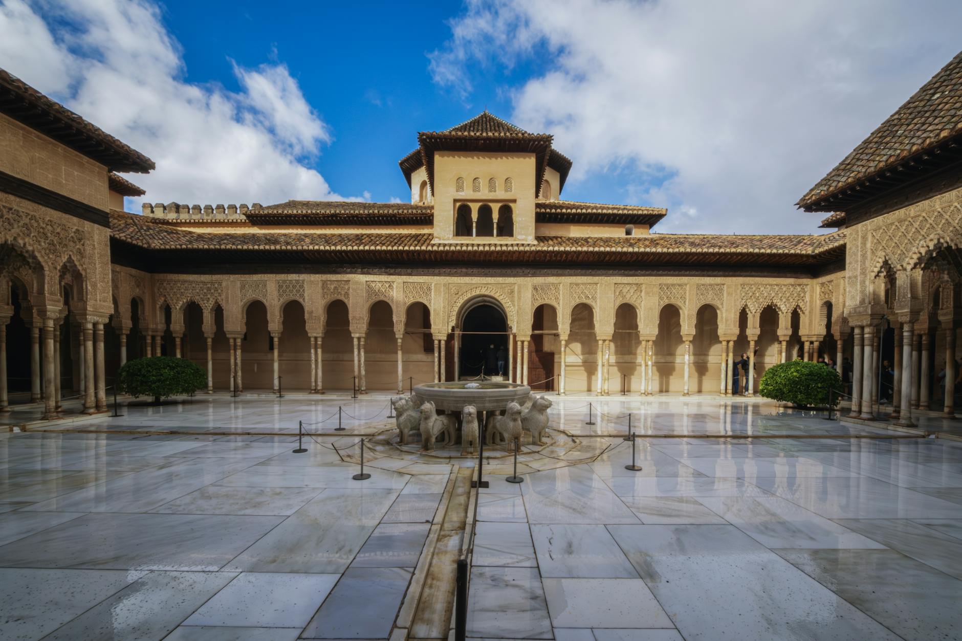 Stunning view of the Courtyard of the Lions at Alhambra, showcasing Moorish architecture.