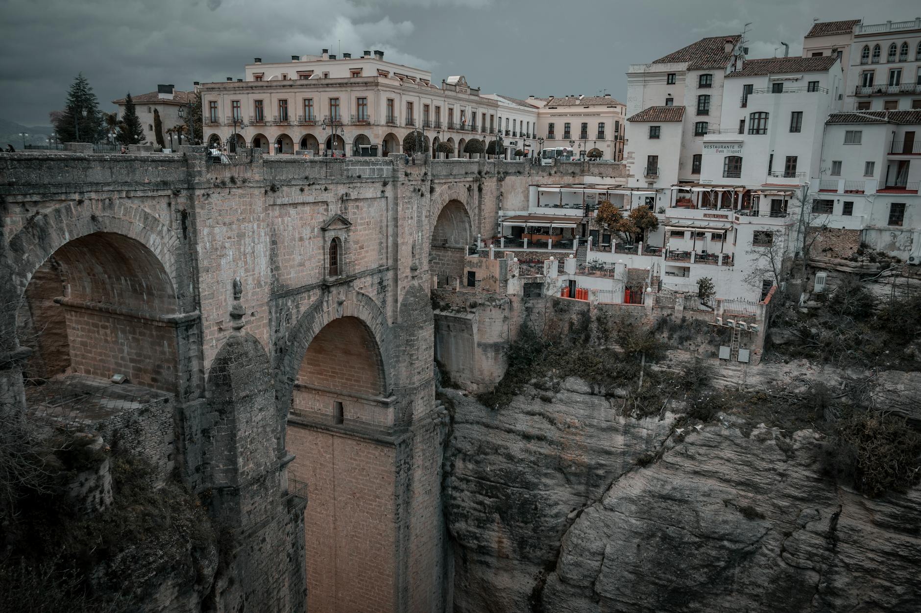 Dramatic view of Ronda's Puente Nuevo bridge over El Tajo gorge in Spain.