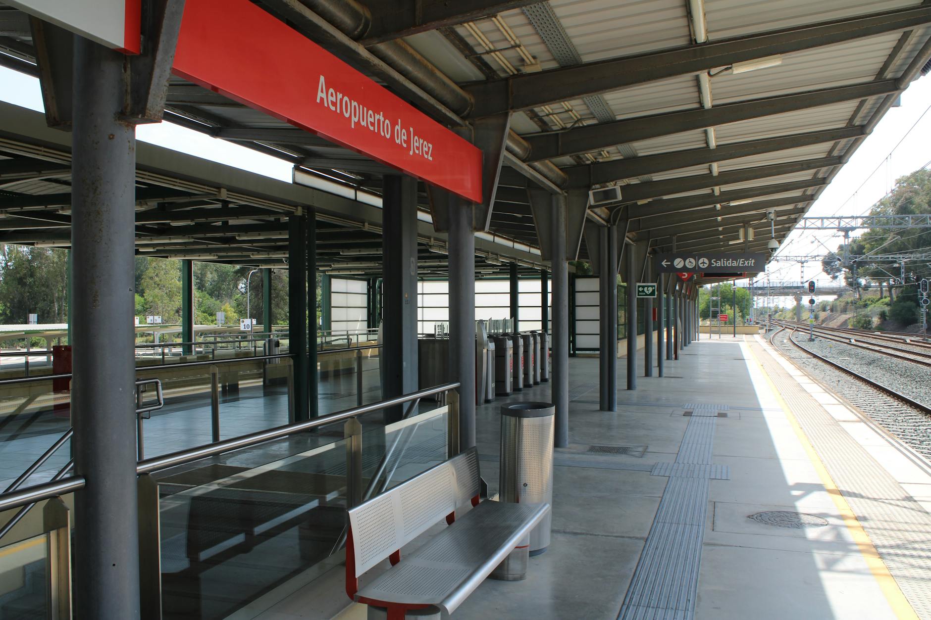 Modern design of Jerez de la Frontera airport train station platform under bright daylight.