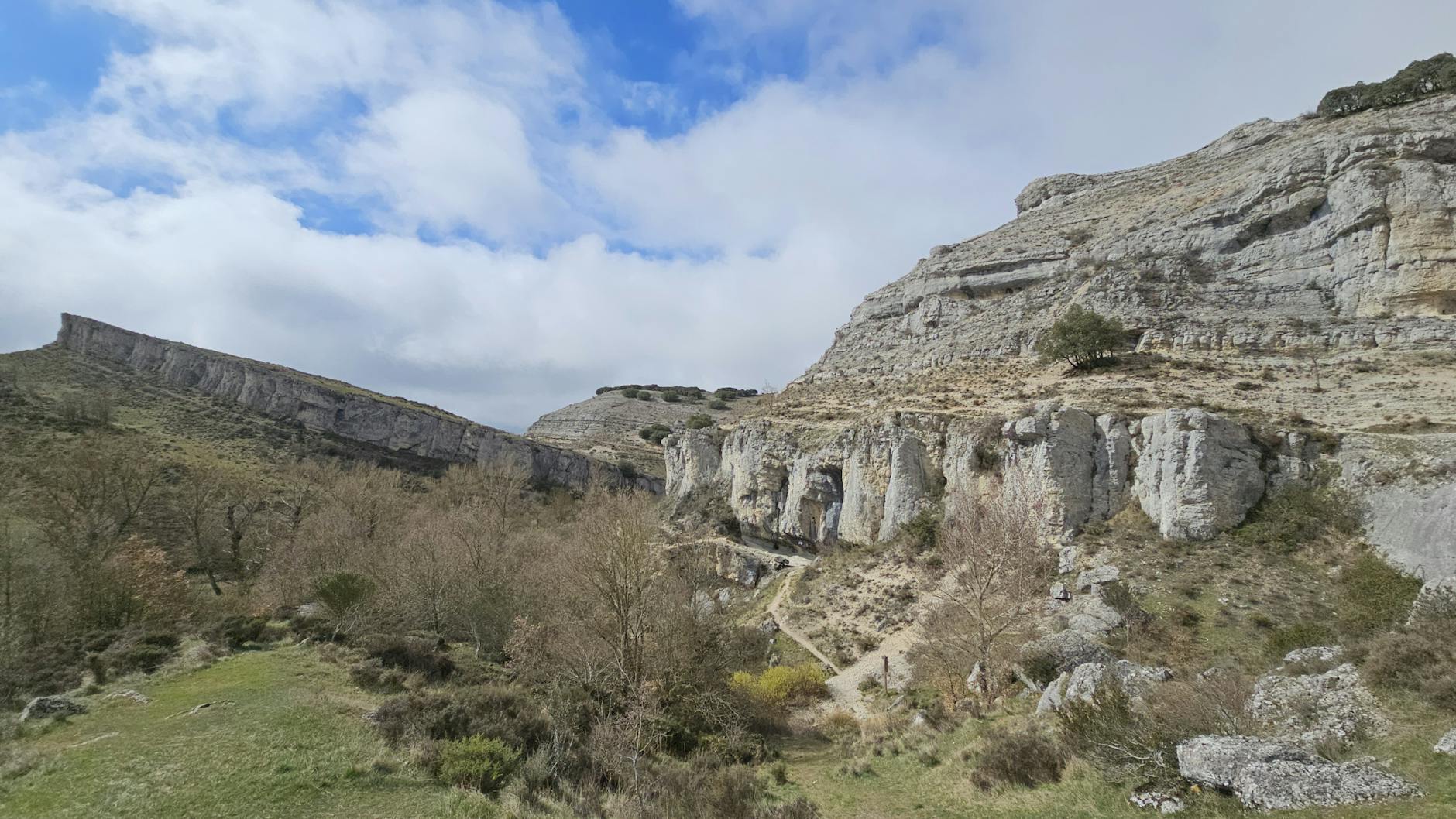 Dramatic view of limestone cliffs and rugged terrain in Aguilar de Campoo, Spain.