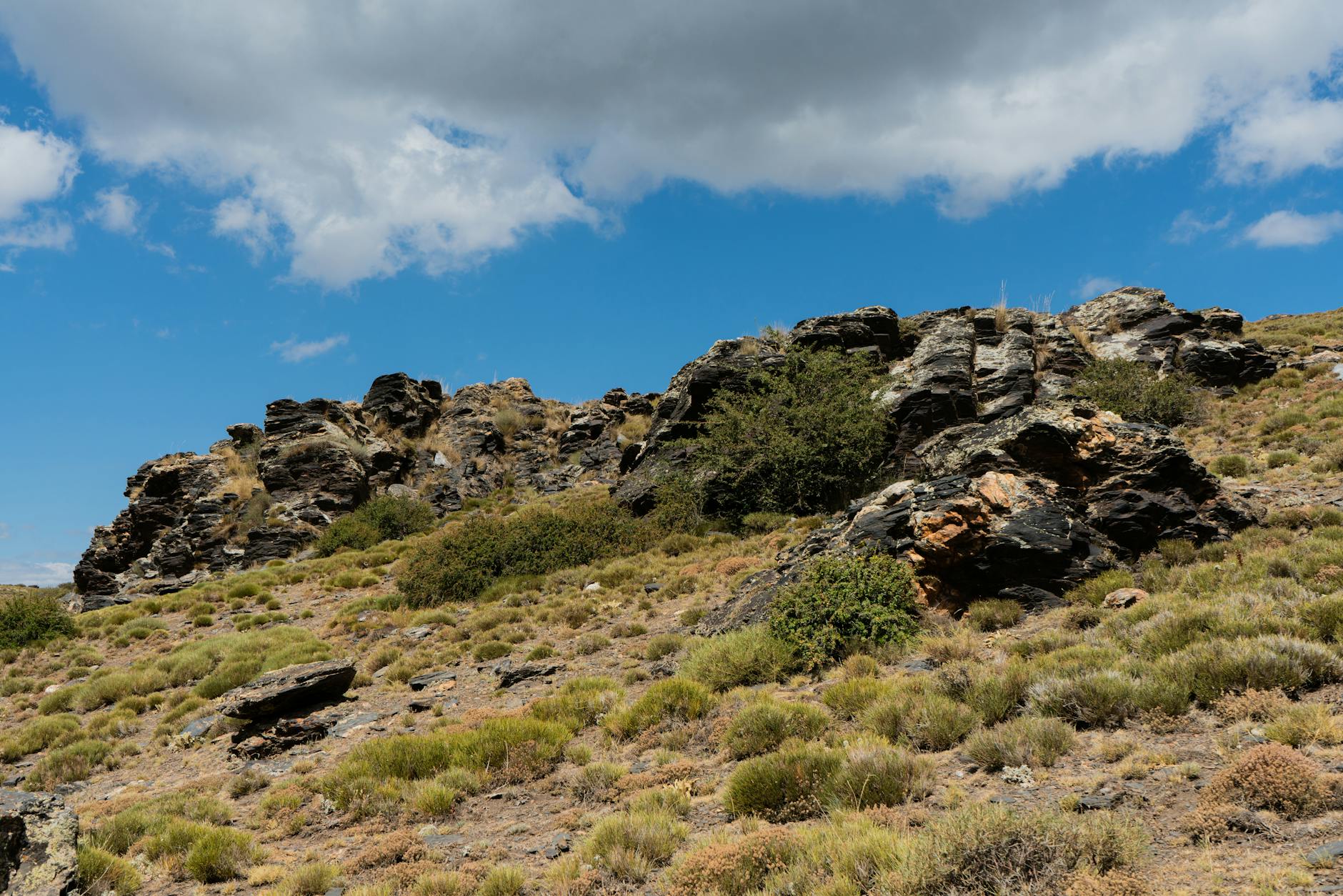Stunning view of a rocky landscape in Sierra Nevada, Andalucia, Spain under a clear blue sky.