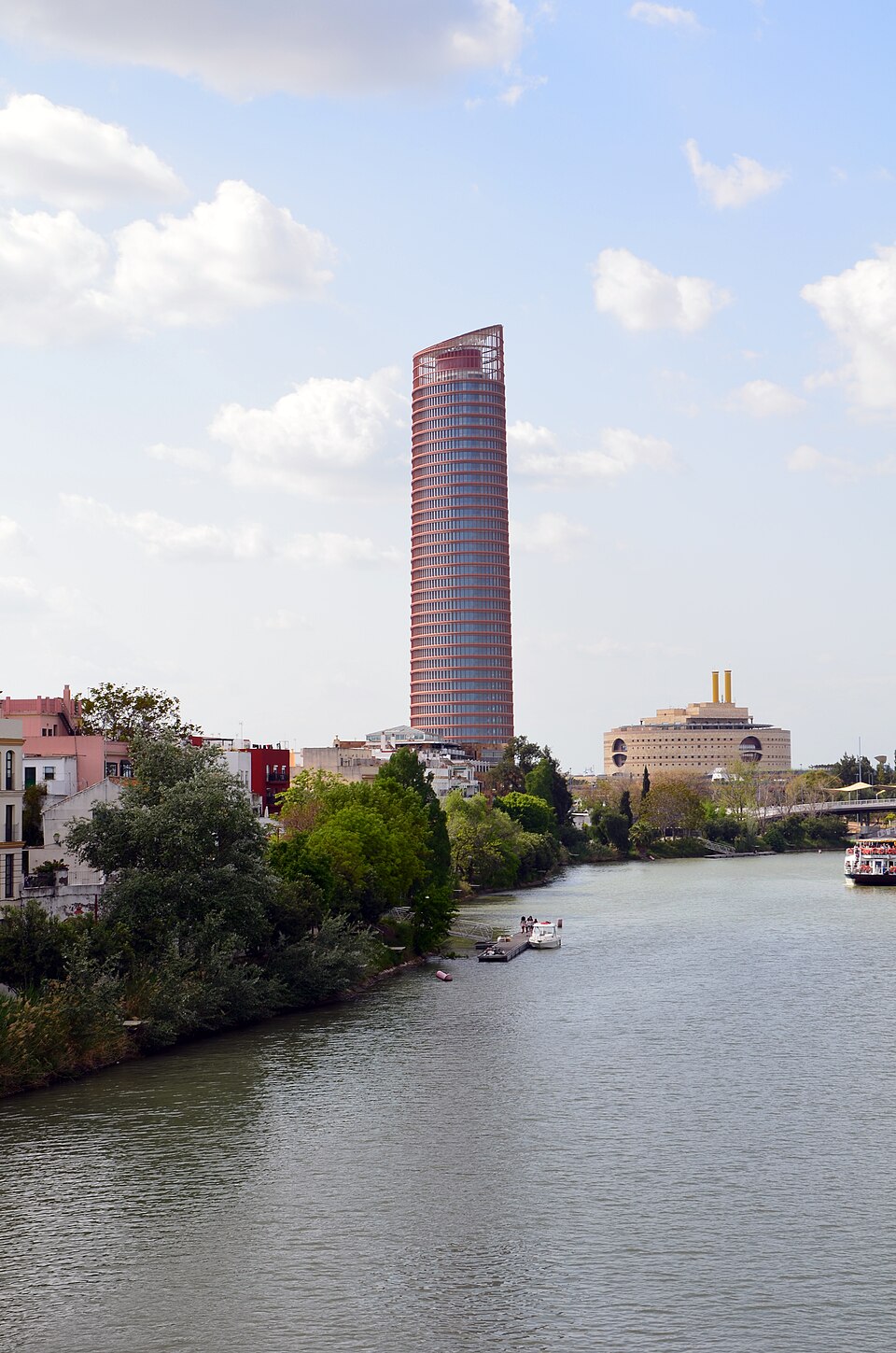 The Sevilla Tower, the Triana Tower (to the right) and the harbour basin of the Guadalquivir river in Seville (Spain), photographed in april 2015 from the Triana bridge.