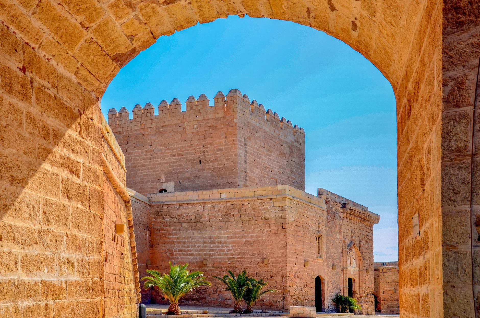Explore the ancient Alcazaba fortress in Almería, Spain under a clear blue sky.